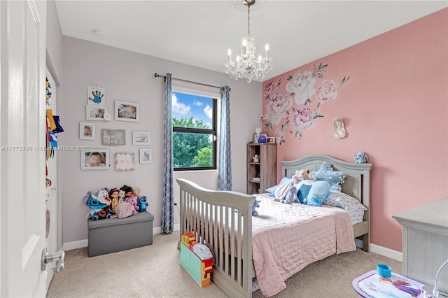 carpeted bedroom featuring an inviting chandelier and baseboards