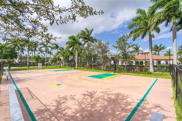view of basketball court with community basketball court and fence