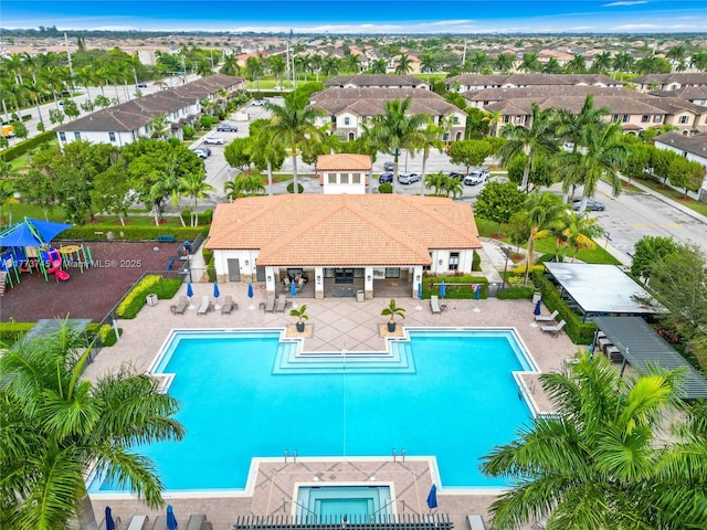 pool featuring a residential view, fence, and a patio area