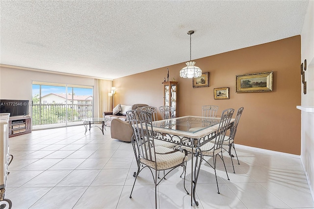12750 SW 4th Ct Unit 407J, Pembroke Pines, FL 33027 - dining space with a textured ceiling and light tile patterned floors