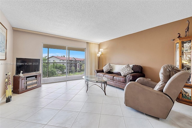 12750 SW 4th Ct Unit 407J, Pembroke Pines, FL 33027 - living room featuring a textured ceiling and light tile patterned floors