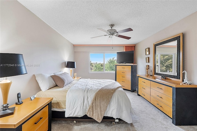 12750 SW 4th Ct Unit 407J, Pembroke Pines, FL 33027 - bedroom with light colored carpet, a textured ceiling, and a ceiling fan