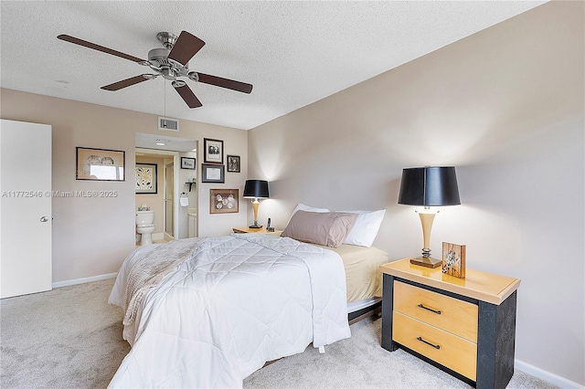 12750 SW 4th Ct Unit 407J, Pembroke Pines, FL 33027 - bedroom with light carpet, a textured ceiling, connected bathroom, and a ceiling fan