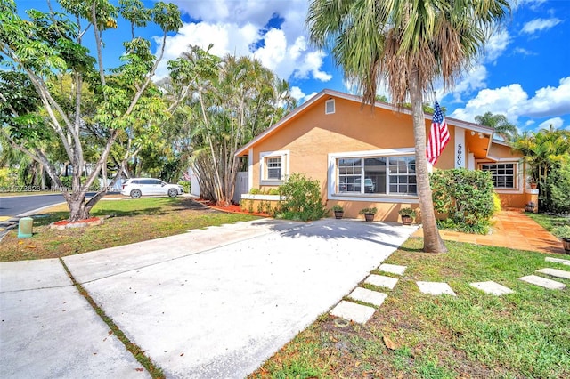 5660 SW 99th Ln, Cooper City, FL 33328 - view of front of house featuring stucco siding, driveway, and a front lawn