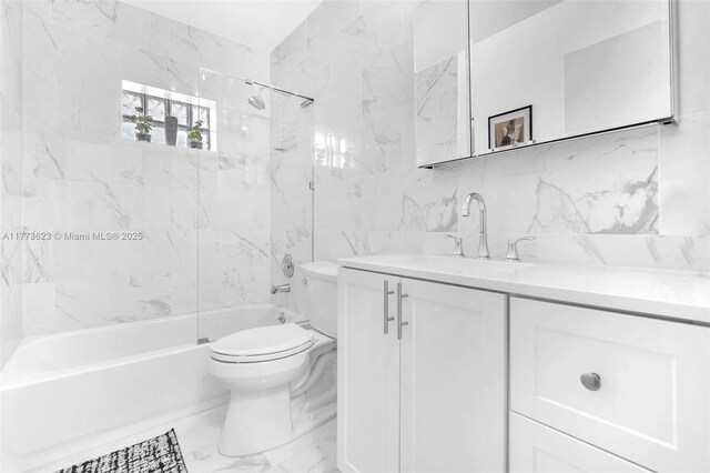 5660 SW 99th Ln, Cooper City, FL 33328 - bathroom with marble finish flooring, toilet, vanity,  shower combination, and tile walls