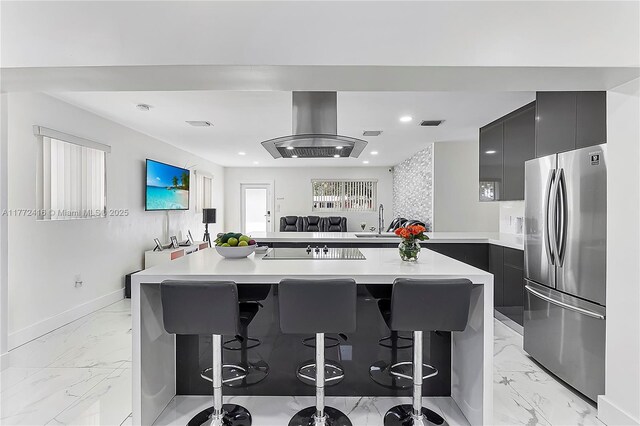 910 N 70th Ave, Hollywood, FL 33024 - kitchen with freestanding refrigerator, modern cabinets, island range hood, dark cabinets, and recessed lighting