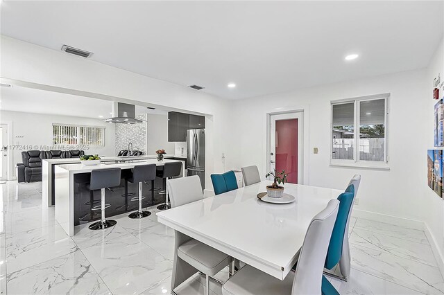 910 N 70th Ave, Hollywood, FL 33024 - dining space with light marble finish floors, recessed lighting, and baseboards