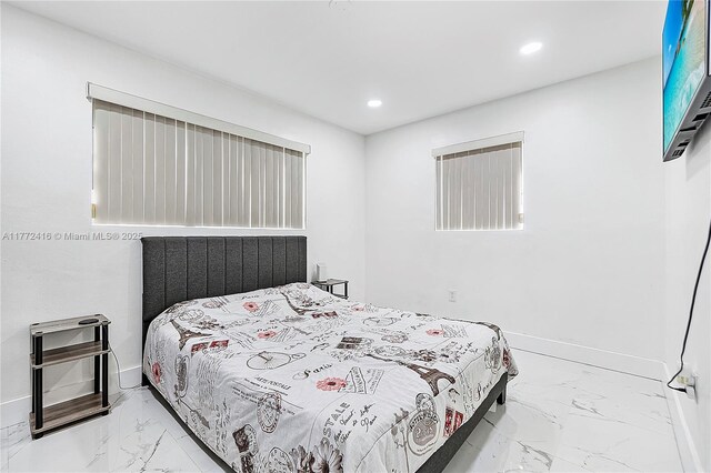 910 N 70th Ave, Hollywood, FL 33024 - bedroom with marble look tiles, recessed lighting, and baseboards