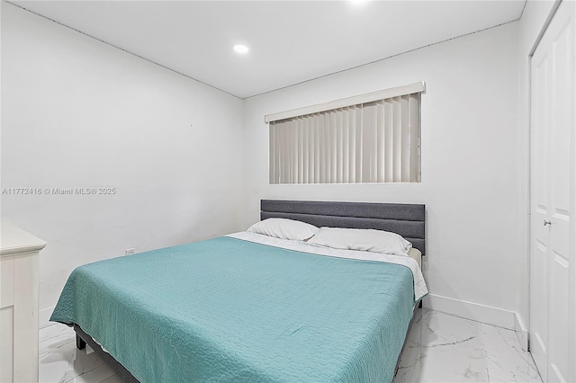 910 N 70th Ave, Hollywood, FL 33024 - bedroom with marble look tile flooring, a closet, baseboards, and recessed lighting