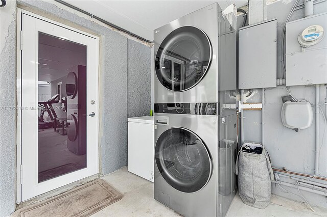 910 N 70th Ave, Hollywood, FL 33024 - laundry room with estacked washer and dryer and a textured wall