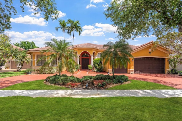 2031 SW 185th Ave, Miramar, FL 33029 - mediterranean / spanish home featuring driveway, a front lawn, stucco siding, and a tiled roof