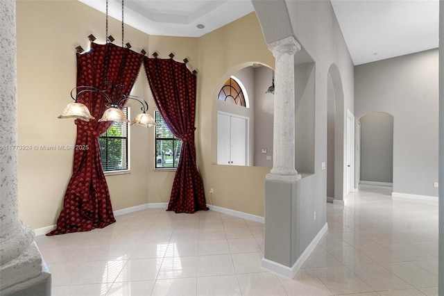 2031 SW 185th Ave, Miramar, FL 33029 - foyer featuring arched walkways, tile patterned flooring, decorative columns, a chandelier, and a towering ceiling