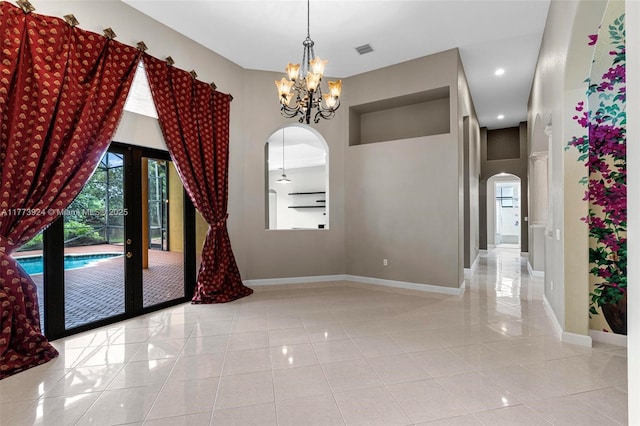 2031 SW 185th Ave, Miramar, FL 33029 - unfurnished dining area featuring arched walkways, tile patterned floors, a chandelier, french doors, and recessed lighting