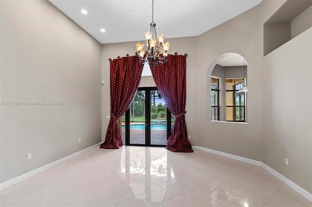2031 SW 185th Ave, Miramar, FL 33029 - unfurnished room with arched walkways, tile patterned flooring, a chandelier, and recessed lighting