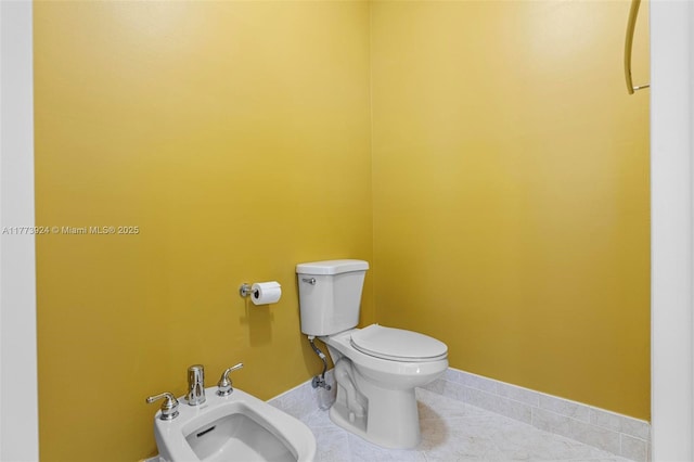 2031 SW 185th Ave, Miramar, FL 33029 - bathroom featuring tile patterned flooring and a bidet