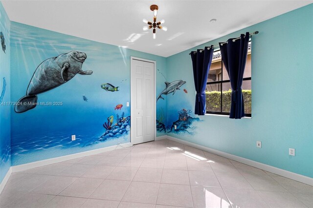 2031 SW 185th Ave, Miramar, FL 33029 - empty room with tile patterned floors and a chandelier