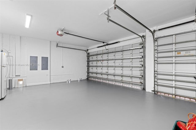 2031 SW 185th Ave, Miramar, FL 33029 - garage featuring electric panel, a garage door opener, and white refrigerator