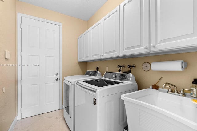 2031 SW 185th Ave, Miramar, FL 33029 - laundry room with washing machine and dryer, cabinet space, and light tile patterned flooring