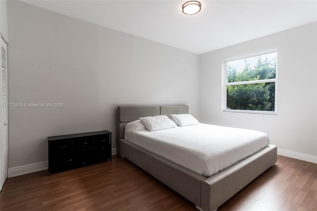 2426 Deer Creek Rd, Weston, FL 33327 - bedroom featuring baseboards and wood finished floors