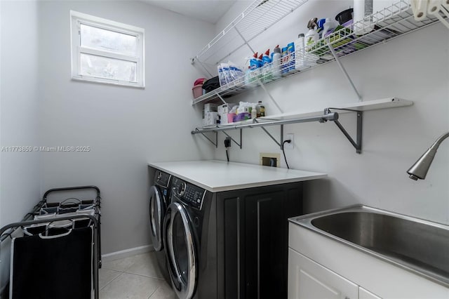 2426 Deer Creek Rd, Weston, FL 33327 - laundry area with a sink, cabinet space, light tile patterned floors, and washer and dryer