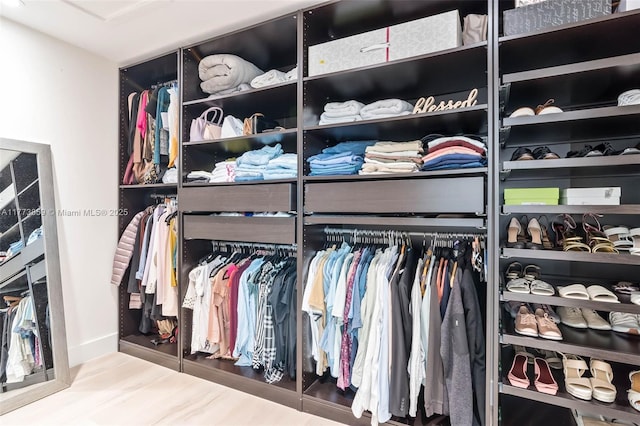 2426 Deer Creek Rd, Weston, FL 33327 - walk in closet featuring wood finished floors