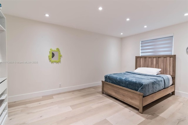 2426 Deer Creek Rd, Weston, FL 33327 - bedroom featuring recessed lighting, baseboards, and light wood finished floors