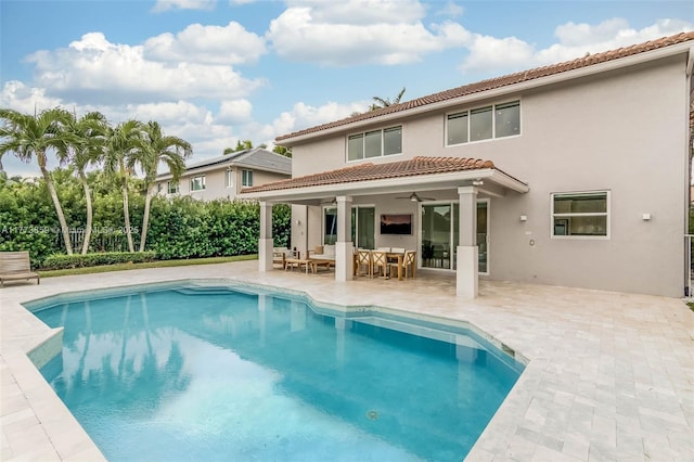 2426 Deer Creek Rd, Weston, FL 33327 - rear view of house featuring a ceiling fan, stucco siding, a patio area, and a tile roof