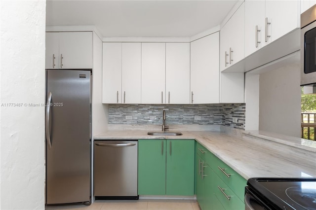 6890 N Kendall Dr Unit B202, Pinecrest, FL 33156 - kitchen featuring stainless steel appliances, decorative backsplash, and white cabinets