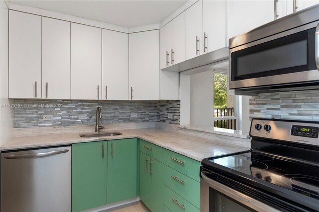 6890 N Kendall Dr Unit B202, Pinecrest, FL 33156 - kitchen with stainless steel appliances, white cabinetry, and tasteful backsplash