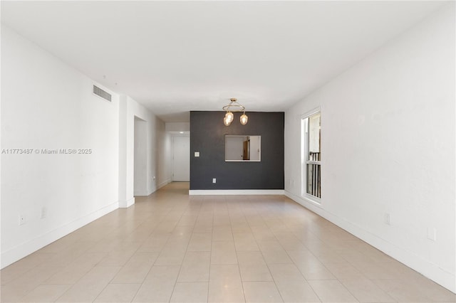 6890 N Kendall Dr Unit B202, Pinecrest, FL 33156 - spare room featuring a chandelier and baseboards