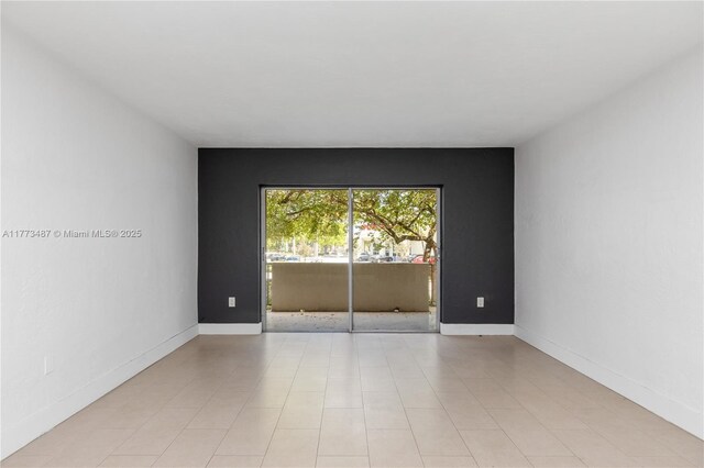 6890 N Kendall Dr Unit B202, Pinecrest, FL 33156 - spare room with baseboards