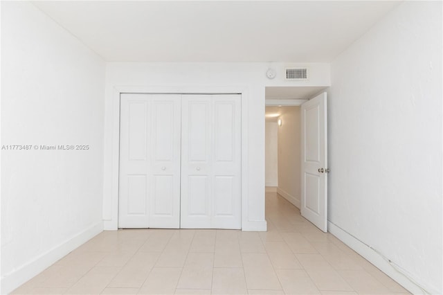 6890 N Kendall Dr Unit B202, Pinecrest, FL 33156 - unfurnished bedroom with a closet and light tile patterned floors