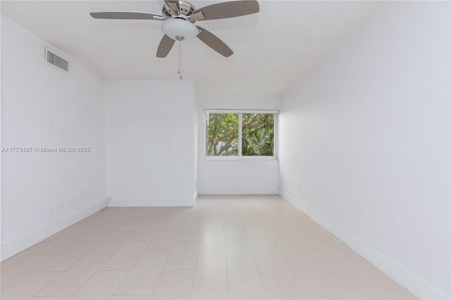 6890 N Kendall Dr Unit B202, Pinecrest, FL 33156 - spare room featuring a ceiling fan and baseboards