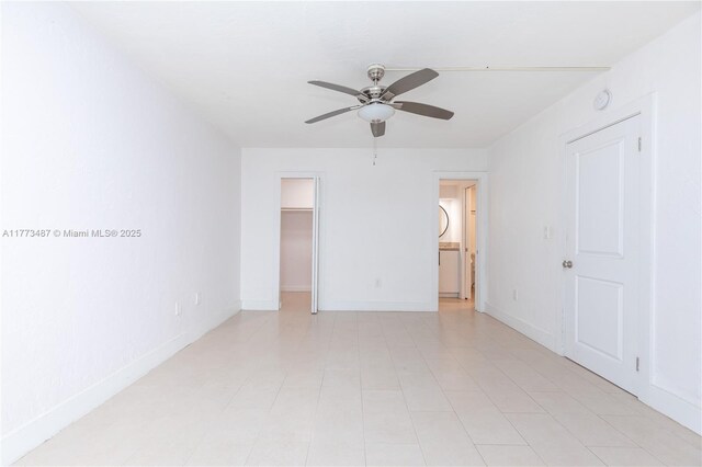 6890 N Kendall Dr Unit B202, Pinecrest, FL 33156 - unfurnished bedroom featuring a walk in closet, a ceiling fan, a closet, and ensuite bath