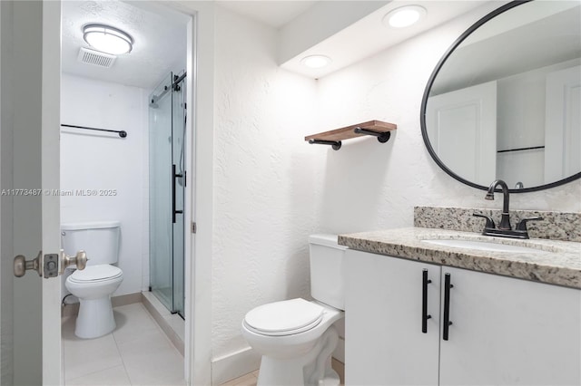 6890 N Kendall Dr Unit B202, Pinecrest, FL 33156 - bathroom featuring vanity, a stall shower, tile patterned floors, and a textured wall