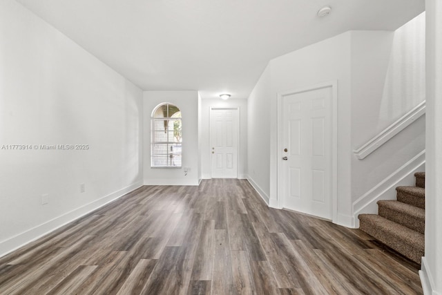 2556 SE 15th Ct, Homestead, FL 33035 - empty room featuring baseboards, stairway, and dark wood-type flooring