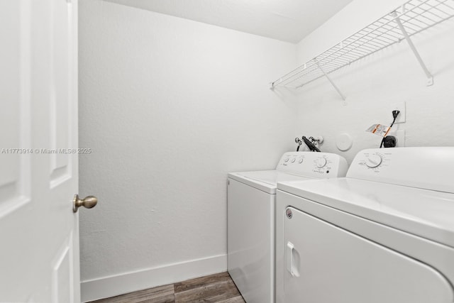 2556 SE 15th Ct, Homestead, FL 33035 - washroom with washing machine and clothes dryer, baseboards, laundry area, and dark wood finished floors