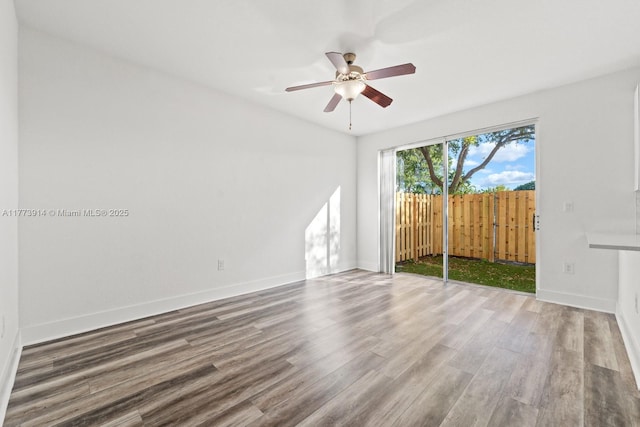 2556 SE 15th Ct, Homestead, FL 33035 - spare room featuring baseboards, ceiling fan, and wood finished floors