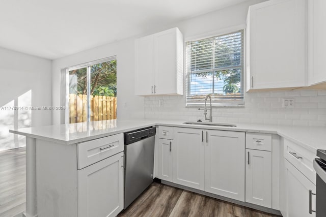 2556 SE 15th Ct, Homestead, FL 33035 - kitchen featuring dark wood-style flooring, white cabinets, a peninsula, dishwasher, and a sink