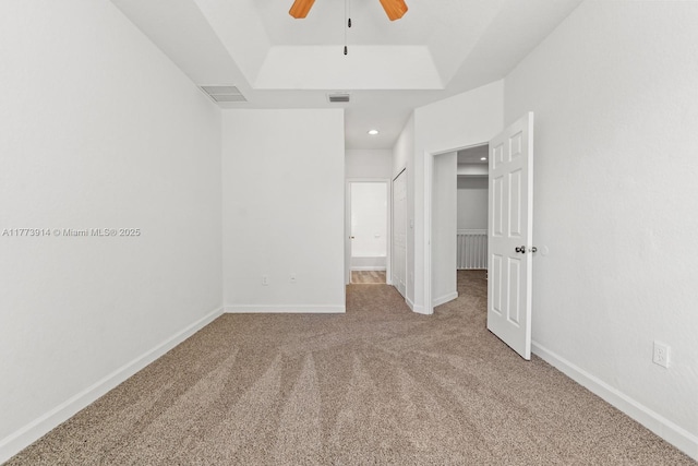 2556 SE 15th Ct, Homestead, FL 33035 - unfurnished bedroom featuring a raised ceiling, carpet, baseboards, and visible vents