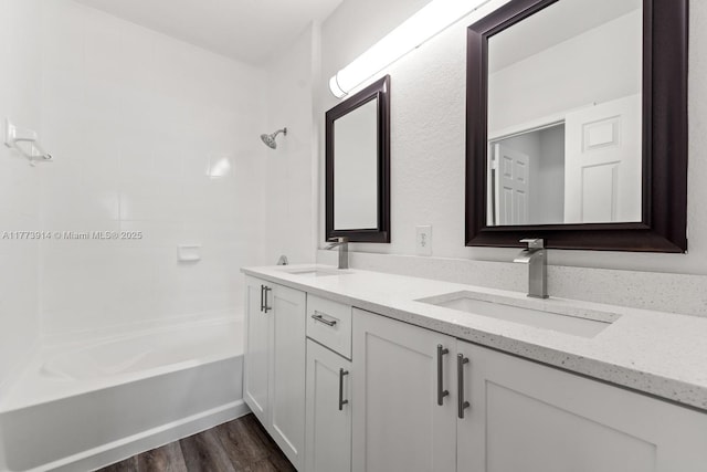 2556 SE 15th Ct, Homestead, FL 33035 - bathroom featuring double vanity, wood finished floors, a sink, and shower / bathtub combination