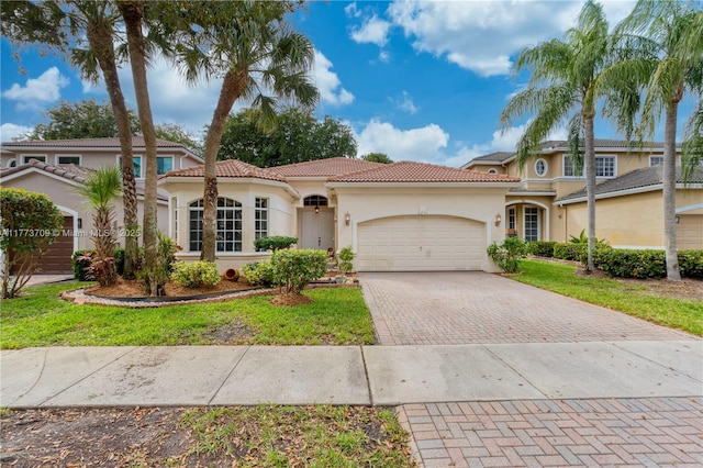 6231 SW 195th Ave, Pembroke Pines, FL 33332 - mediterranean / spanish home featuring decorative driveway, stucco siding, a garage, and a tile roof