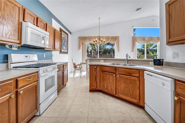 6231 SW 195th Ave, Pembroke Pines, FL 33332 - kitchen with white appliances, lofted ceiling, a sink, a chandelier, and a textured ceiling