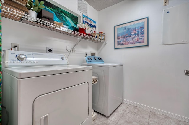 6231 SW 195th Ave, Pembroke Pines, FL 33332 - washroom with separate washer and dryer and light tile patterned flooring