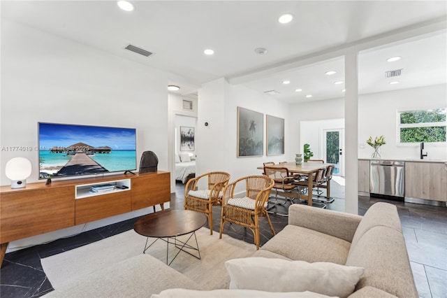 living room with recessed lighting and visible vents