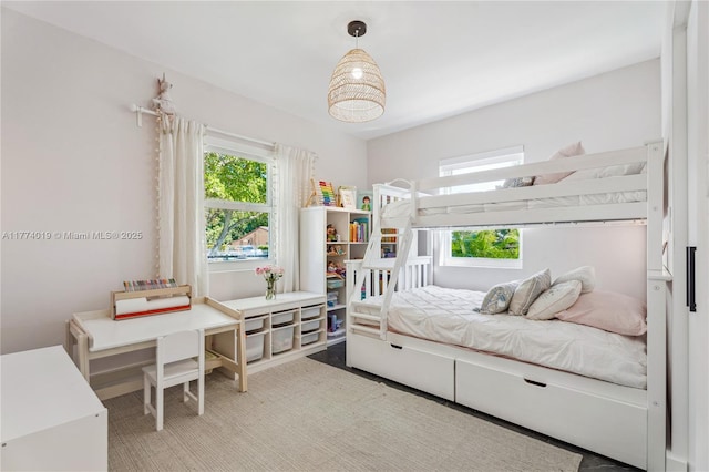 bedroom with multiple windows