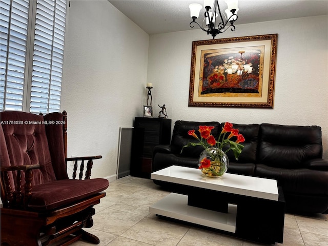 living room featuring a chandelier, baseboards, and light tile patterned flooring