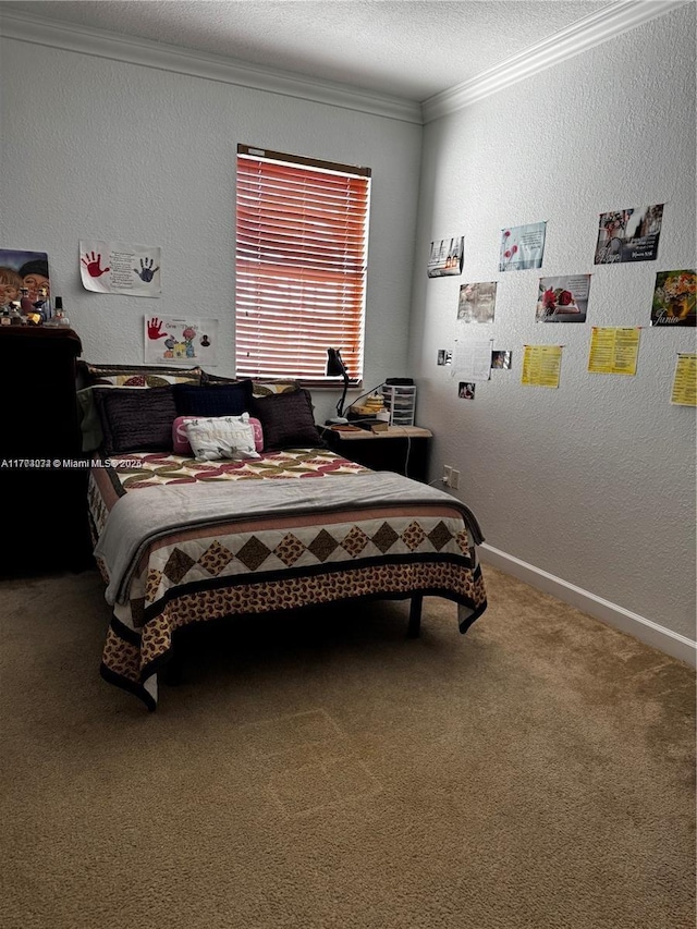 bedroom with ornamental molding, carpet, baseboards, and a textured wall