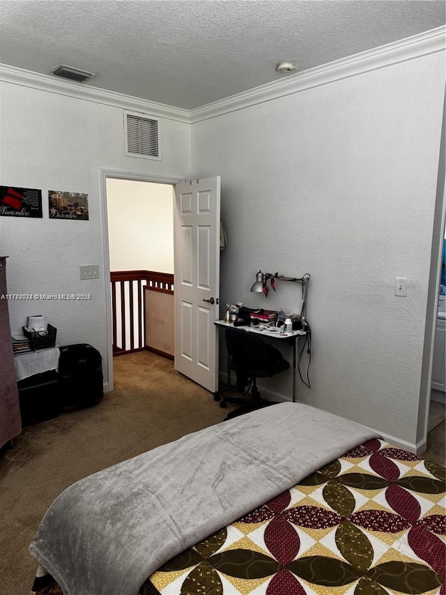 bedroom featuring crown molding, a textured ceiling, carpet, and visible vents