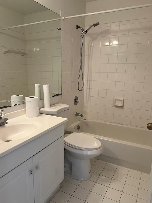 bathroom featuring bathtub / shower combination, toilet, tile patterned flooring, and vanity